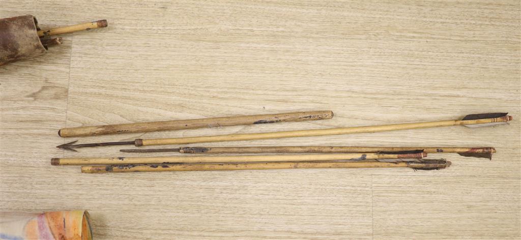 Ethnographica: a hide quiver and arrows, a hardwood stool and a painted panel
